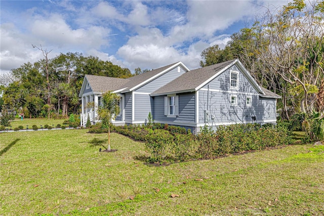 view of home's exterior with a yard