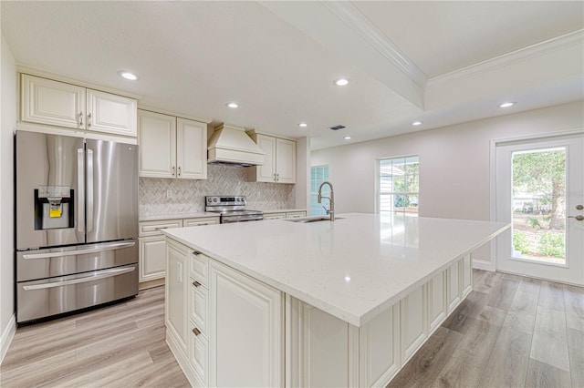 kitchen featuring appliances with stainless steel finishes, sink, a kitchen island with sink, and custom exhaust hood