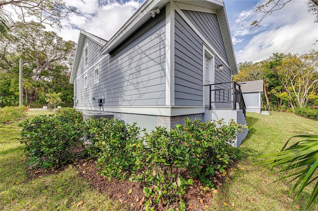 view of property exterior with a yard