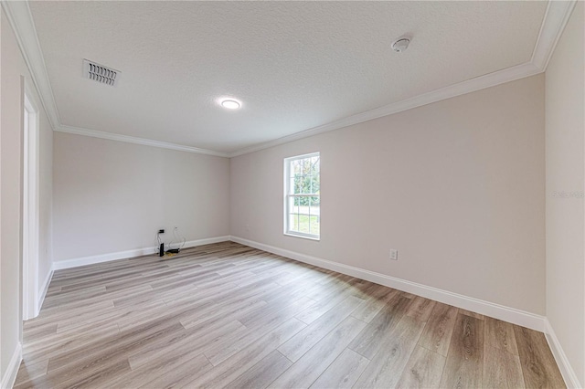 unfurnished room with crown molding, light hardwood / wood-style flooring, and a textured ceiling