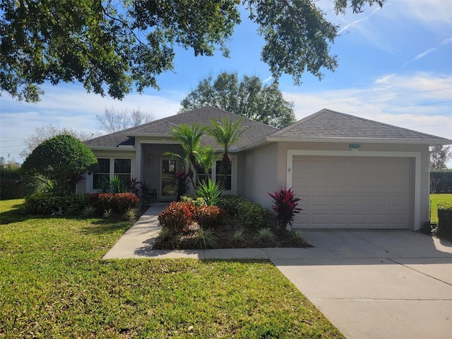 ranch-style house with a garage and a front yard