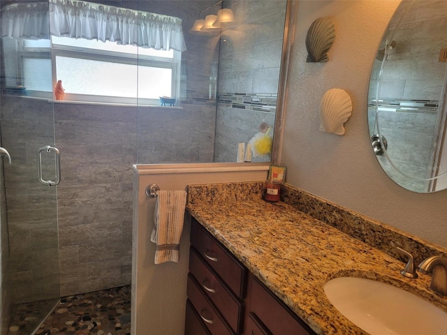 bathroom featuring vanity and walk in shower