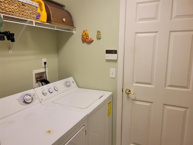 washroom featuring separate washer and dryer