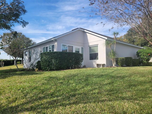 view of side of property featuring a yard