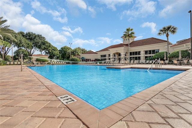 view of swimming pool with a patio