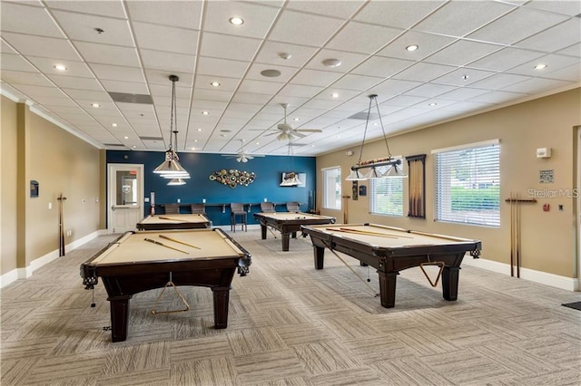 recreation room with a paneled ceiling, ceiling fan, and billiards