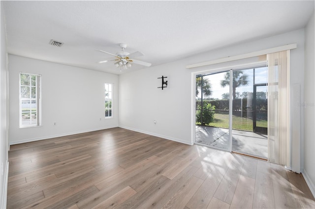 spare room featuring ceiling fan and light wood-type flooring