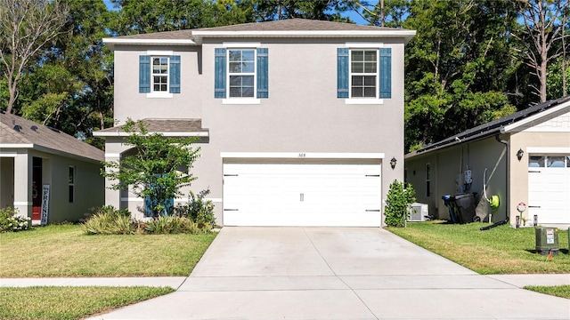 view of front of house with a garage and a front lawn