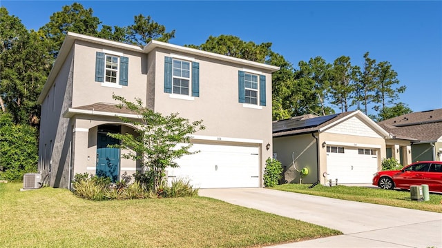 view of front of property with solar panels, central AC, a front lawn, and a garage