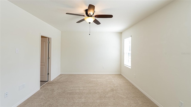 empty room with light carpet and ceiling fan