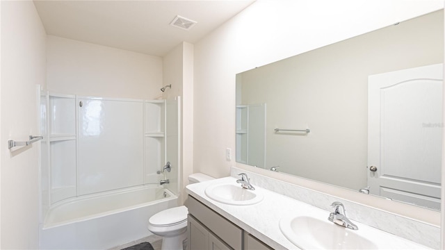 full bathroom featuring shower / bathing tub combination, vanity, and toilet