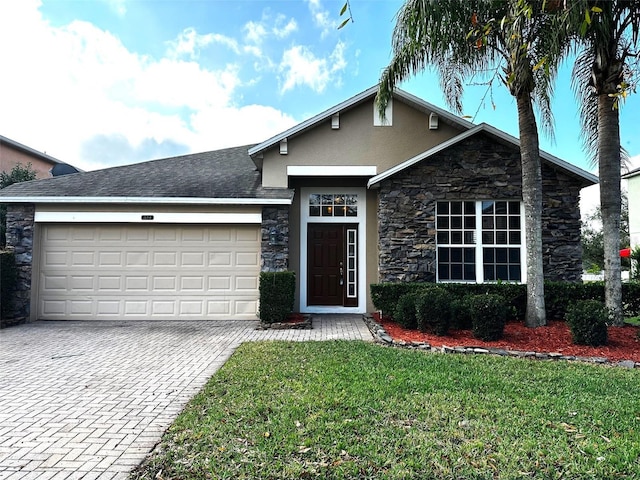 view of front facade featuring a garage and a front lawn