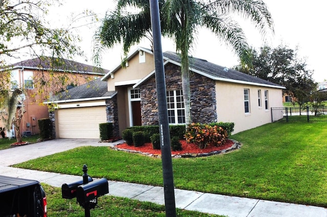 view of front of home featuring a garage and a front lawn