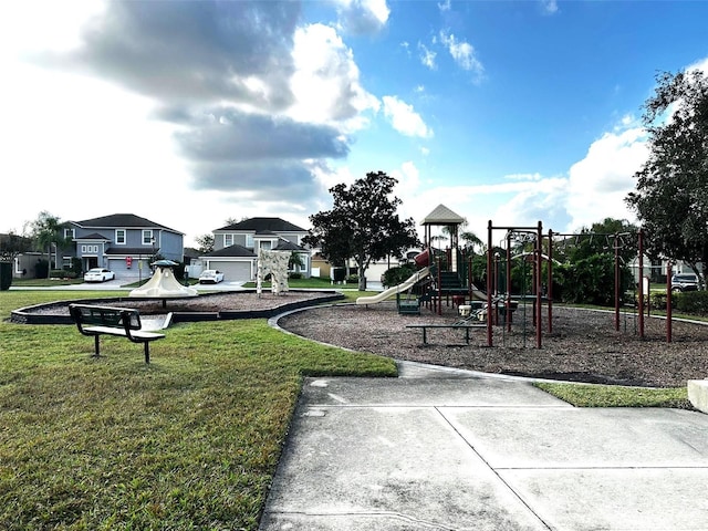 view of playground with a lawn