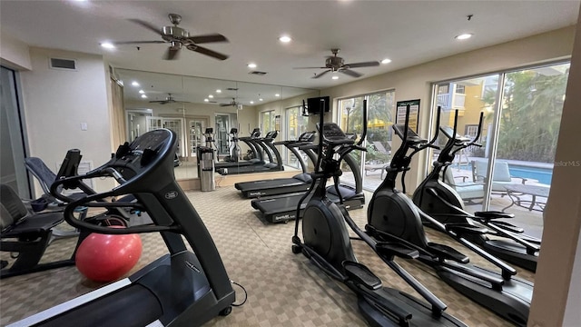 workout area with light carpet, french doors, and ceiling fan