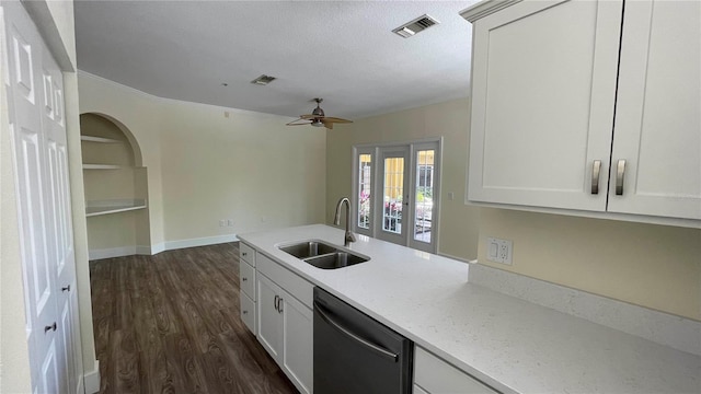 kitchen featuring dishwasher, sink, ceiling fan, light stone counters, and white cabinetry