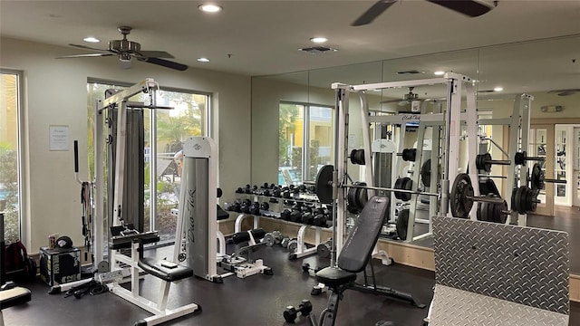 exercise room with ceiling fan