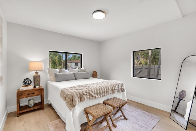 bedroom with light hardwood / wood-style flooring