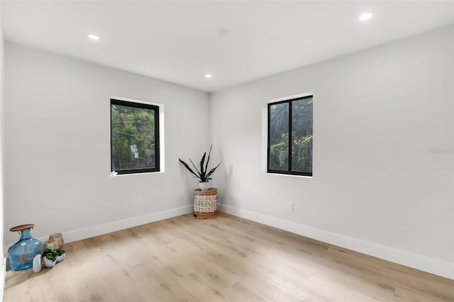 spare room with light hardwood / wood-style floors