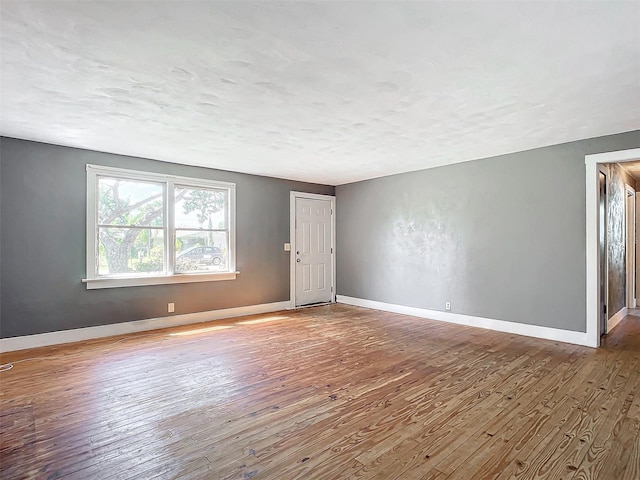 empty room featuring hardwood / wood-style floors