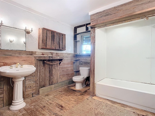 bathroom featuring hardwood / wood-style floors and toilet