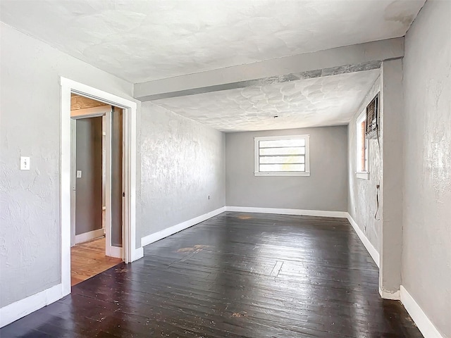 unfurnished room with dark hardwood / wood-style floors