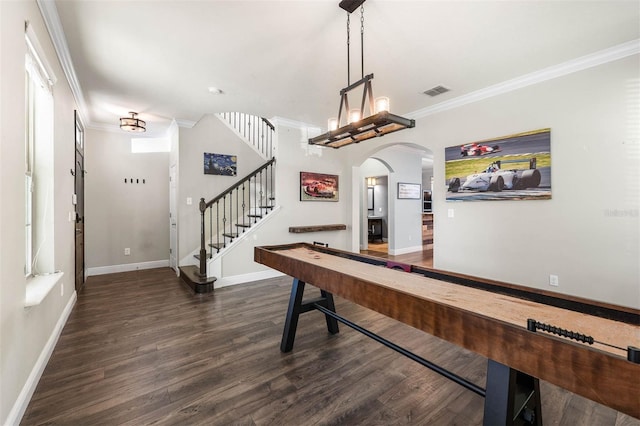 playroom with dark hardwood / wood-style floors and crown molding