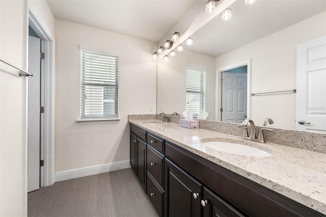 bathroom with hardwood / wood-style flooring and vanity