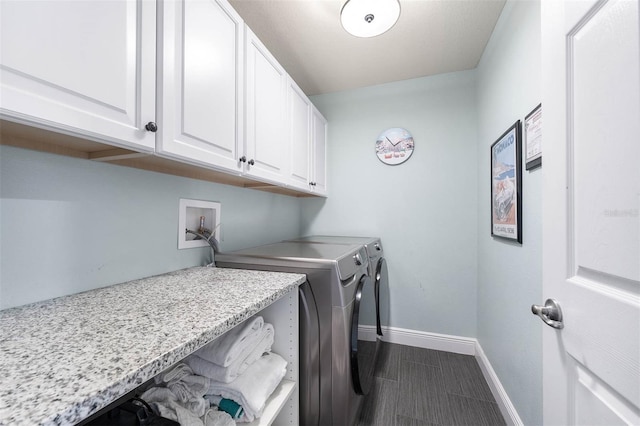 washroom with cabinets and independent washer and dryer