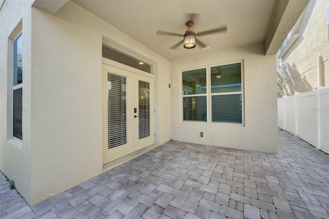 view of patio / terrace featuring ceiling fan and french doors