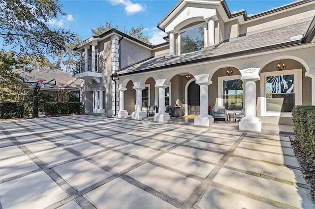 rear view of property featuring a patio