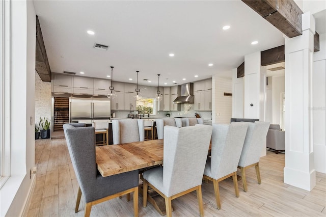 dining space with light hardwood / wood-style floors