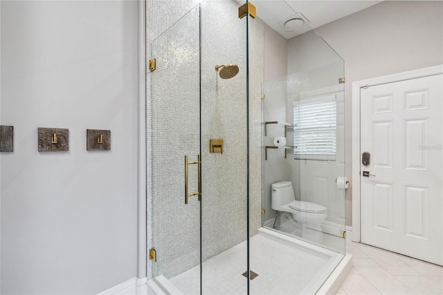 bathroom with toilet, a shower with door, and tile patterned flooring