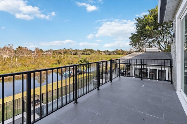 balcony featuring a water view