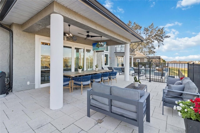 view of patio with ceiling fan and outdoor lounge area