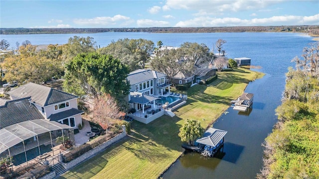 birds eye view of property with a water view