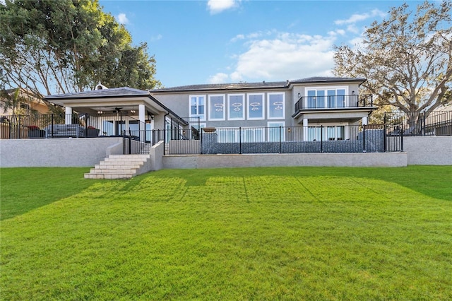 rear view of house with a lawn