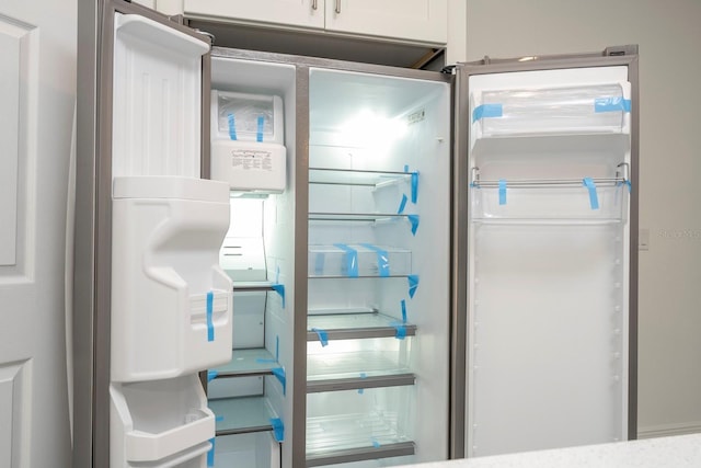 interior details with refrigerator with ice dispenser