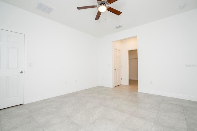 spare room with ceiling fan