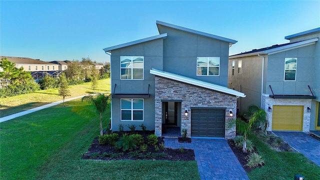 modern home with a garage and a front lawn