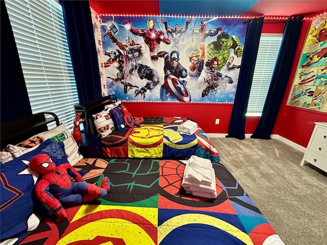 recreation room with carpet floors and a wealth of natural light