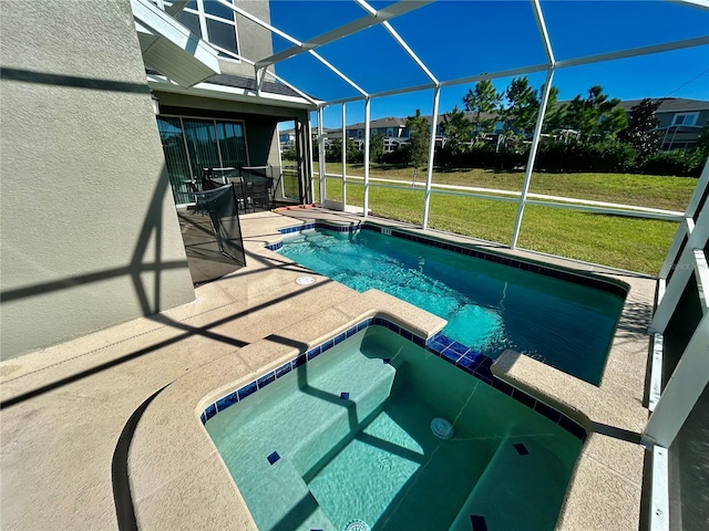 view of pool with a lawn, glass enclosure, and a patio