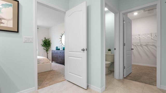 bathroom with tile patterned flooring and toilet