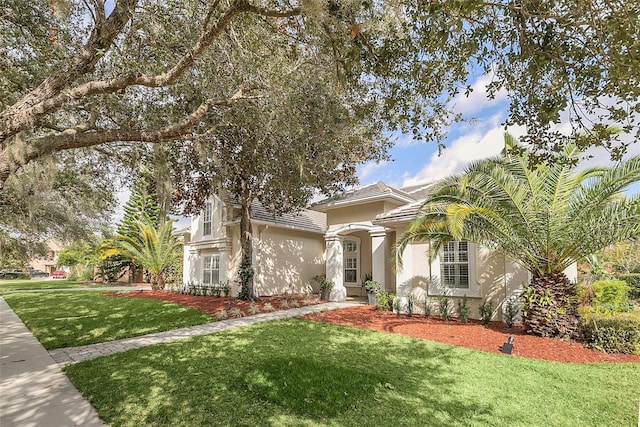1610 Conway Isle Cir, Belle Isle, FL 32809 - view of front of home featuring stucco siding and a front lawn
