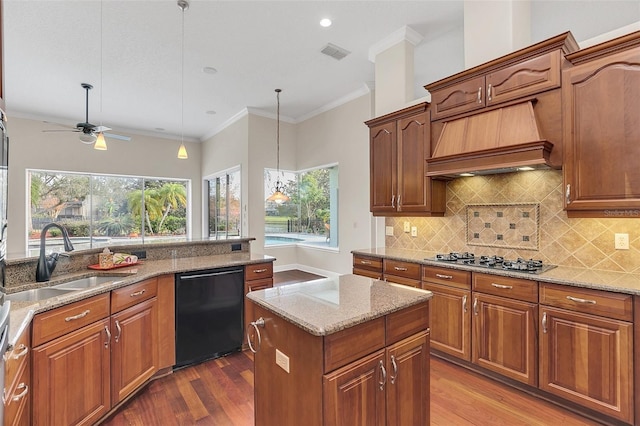1610 Conway Isle Cir, Belle Isle, FL 32809 - kitchen with dishwasher, stainless steel gas stovetop, dark wood finished floors, decorative backsplash, and crown molding