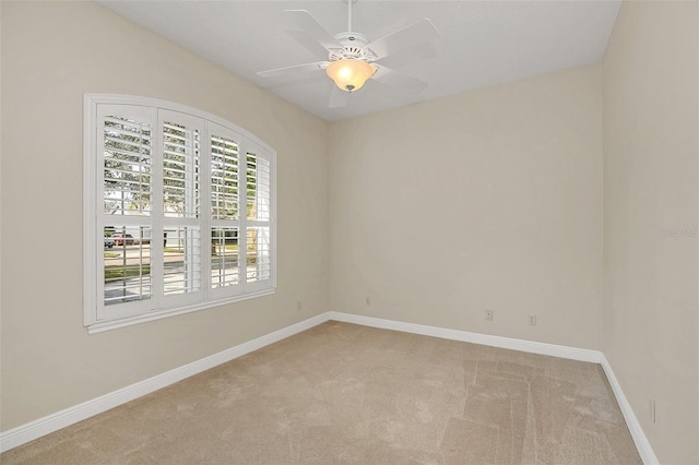 carpeted empty room with ceiling fan