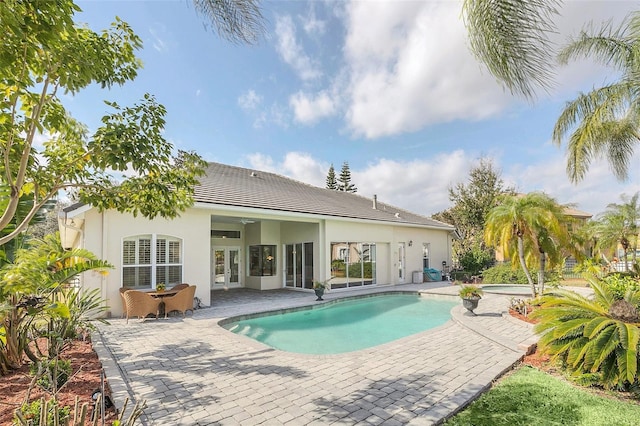 1610 Conway Isle Cir, Belle Isle, FL 32809 - swimming pool featuring a patio and an in-ground hot tub