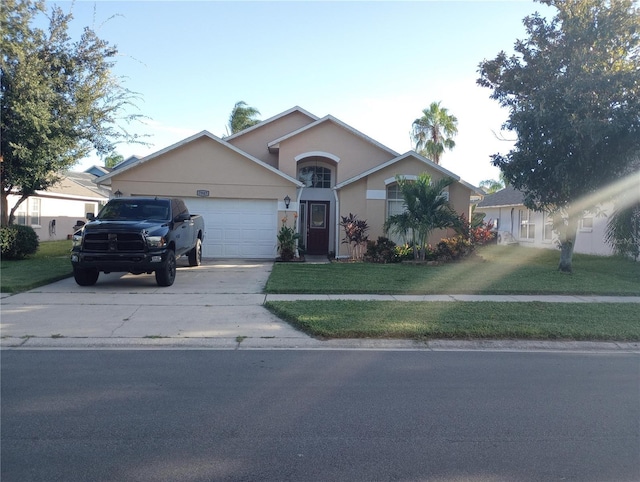 ranch-style home with a front yard and a garage