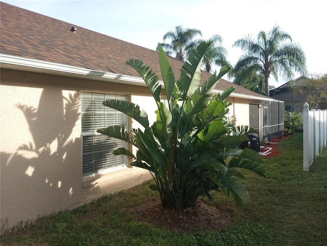 view of property exterior with a yard