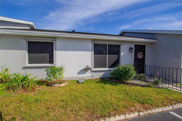 79 Lake Villa Way, Kissimmee, FL 34743 - doorway to property with a lawn
